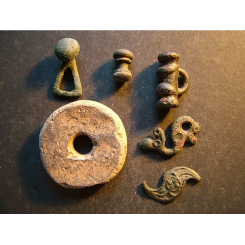 653 - Late Iron Age / Roman.  Small mixed lot, including clay spindle whorl. Approximately 43mm in diamete... 