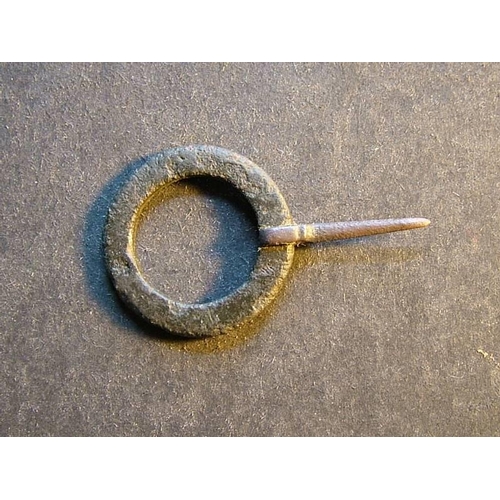 491 - Romano-British.  Small bronze annular brooch, approximately 24mm in diameter, indistinct raised deco... 