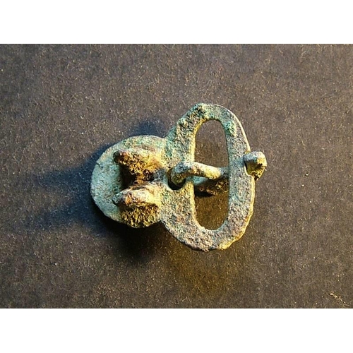 495 - Byzantine.  Small bronze buckle, approximately 30.5mm x 25mm, decorated with 3 small annulets, 2 int... 