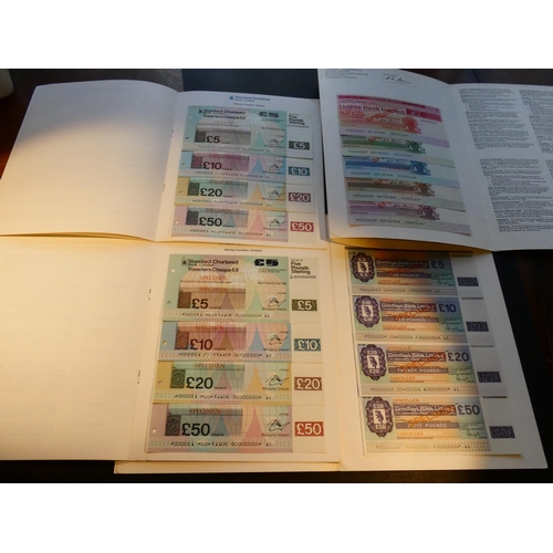 91 - TRAVELLERS' CHEQUES.  Four books of specimen cheques, including GRINDLAYS BANK New Series 1975, £5, ... 