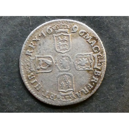 244 - UNITED KINGDOM.  Sixpence.  1696, 2nd bust, two locks of hair across breast, no stop after GRA, late... 