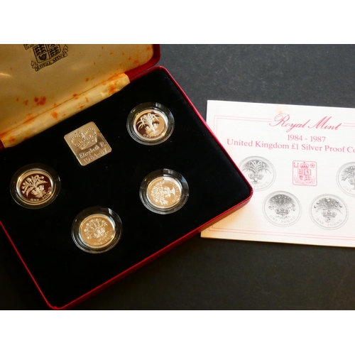 274 - UNITED KINGDOM. 1 Pound.  Collection of four coins, 1984 to 1987, silver Proofs, cased.  NFDC, case ... 