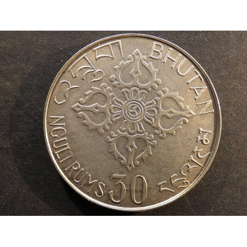 21 - COINS - BHUTAN.  Silver 30 Ngultrums, 1975, International Women's Year, KM44, GVF, light toning.