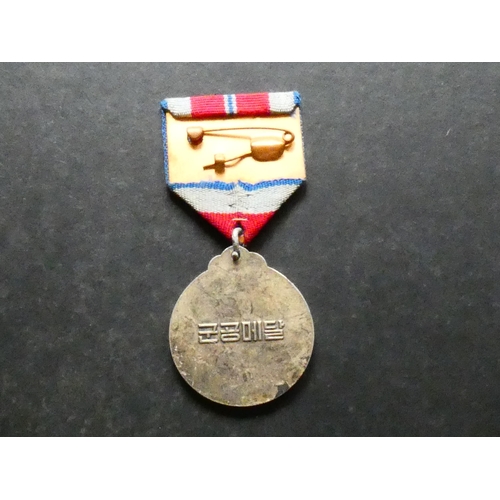 514 - NORTH KOREA.  Military Merit Medal, with ribbon, GVF