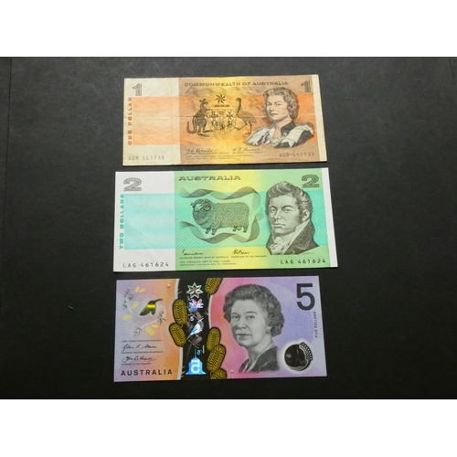 12 - AUSTRALIA.  $1, ND(1968), scarce, sign. Coombs-Randall, P-37b, VG, together with $2, ND(1985), sign.... 