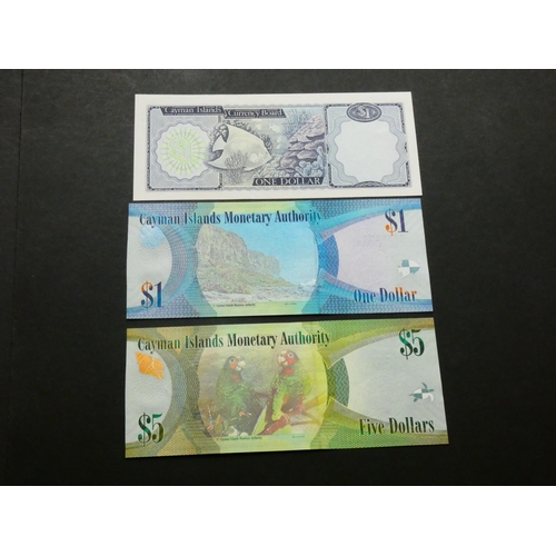 16 - CAYMAN ISLANDS.  $1, ND, L.1971(1974), P-1b, together with $1, 2010, P-38a and $5, 2010, P-39a, UNC ... 