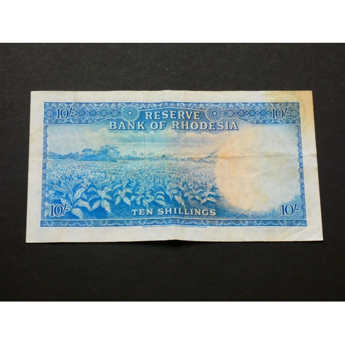 49 - RHODESIA.  10 Shillings, 30.9.1964, first date, P-24a, NVF, light creasing, stain to upper left corn... 