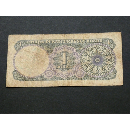 59 - QATAR & DUBAI.  1 Riyal, ND(1966), sign. Khalifa bin Hamad al-Thani, P-1a, VG, graffiti.