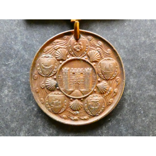 37 - SPORTS.  Isle of Wight, small bronze swimming medal by Vaughton, circa 1910, obverse; swimmers right... 