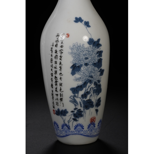 106 - A pair of blue and white with ink colour decorative vase each 19.5cm high, 6cm wide