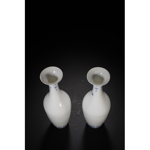 106 - A pair of blue and white with ink colour decorative vase each 19.5cm high, 6cm wide