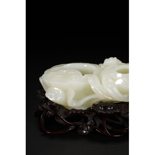 109 - A white jade 'lotus' brush washer, Qing Dynasty 13cm long, 7cm high (with stand), 5.5cm high (withou... 