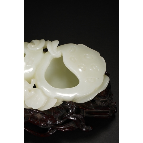 109 - A white jade 'lotus' brush washer, Qing Dynasty 13cm long, 7cm high (with stand), 5.5cm high (withou... 