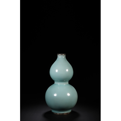 11 - A celadon glazed double gourd vase with imperial poem 23cm high, 12cm wide