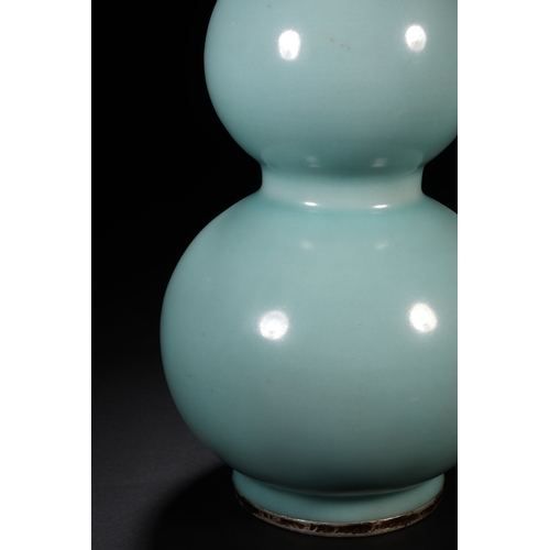 11 - A celadon glazed double gourd vase with imperial poem 23cm high, 12cm wide