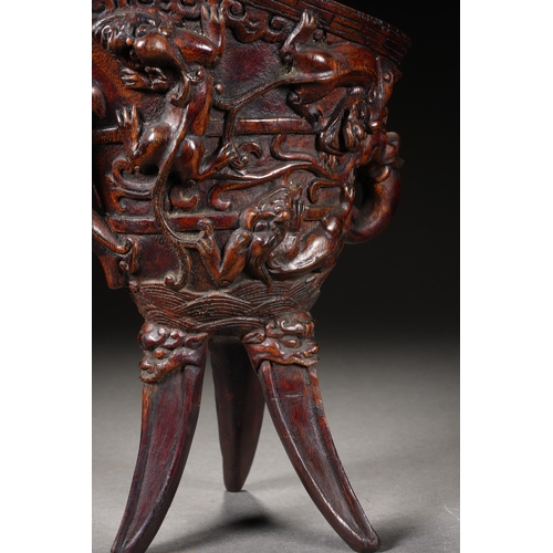 120 - A bamboo carved archaistic rhyton cup, Qing Dynasty 22cm high, 17cm long