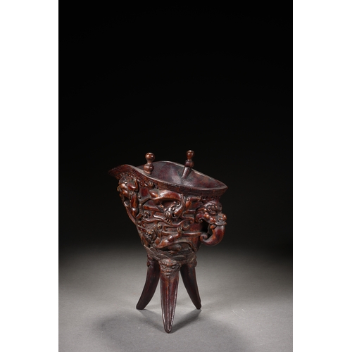 120 - A bamboo carved archaistic rhyton cup, Qing Dynasty 22cm high, 17cm long