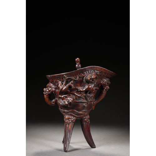 120 - A bamboo carved archaistic rhyton cup, Qing Dynasty 22cm high, 17cm long