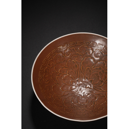 15 - A brown glazed 'floral' conical bowl 14cm diameter, 4cm high