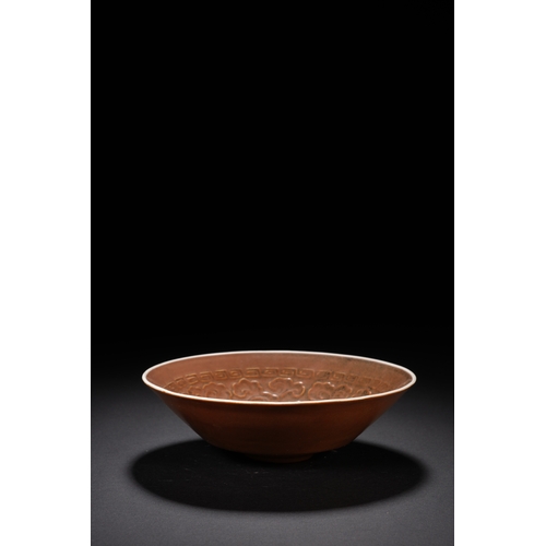 15 - A brown glazed 'floral' conical bowl 14cm diameter, 4cm high