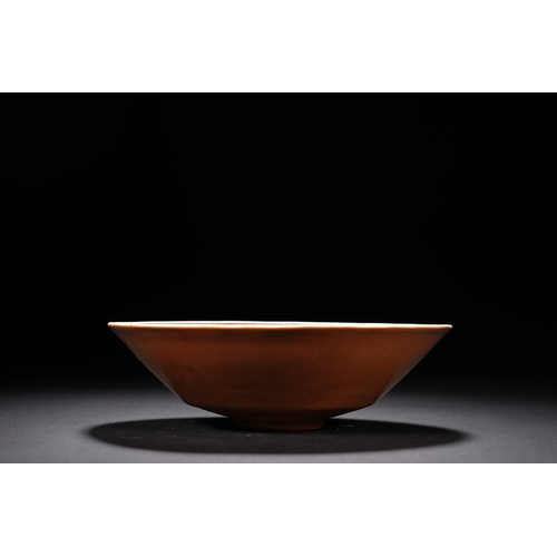 15 - A brown glazed 'floral' conical bowl 14cm diameter, 4cm high