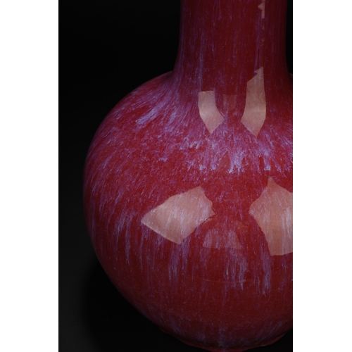 17 - A red glazed globular vase 'tianqiuping' 34cm high