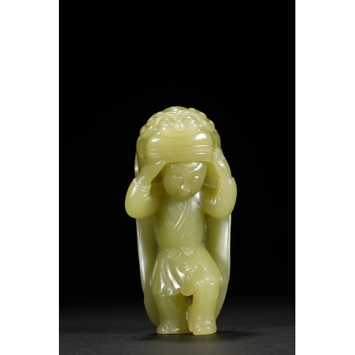 22 - A yellow jade carving 'boy in lion dance costume', Qing Dynasty 8.5cm high