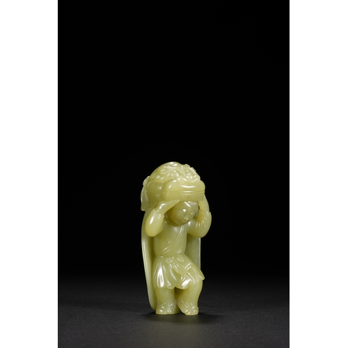 22 - A yellow jade carving 'boy in lion dance costume', Qing Dynasty 8.5cm high