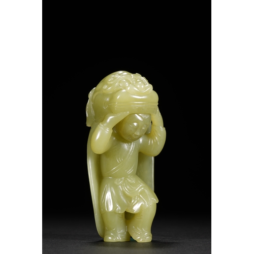 22 - A yellow jade carving 'boy in lion dance costume', Qing Dynasty 8.5cm high