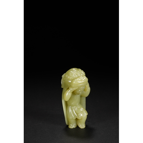 22 - A yellow jade carving 'boy in lion dance costume', Qing Dynasty 8.5cm high