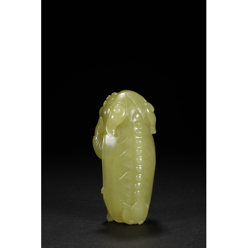 22 - A yellow jade carving 'boy in lion dance costume', Qing Dynasty 8.5cm high