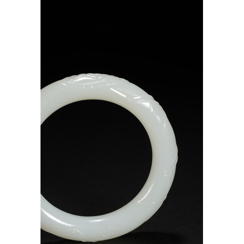 25 - A white jade 'bamboo' bangle, Qing Dynasty 7.9cm diameter