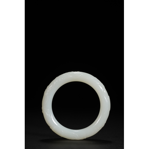 25 - A white jade 'bamboo' bangle, Qing Dynasty 7.9cm diameter