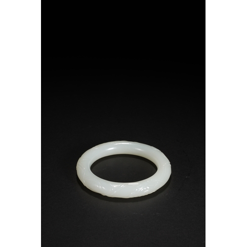 25 - A white jade 'bamboo' bangle, Qing Dynasty 7.9cm diameter