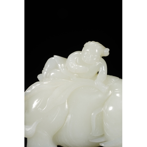 26 - A white jade carving 'boy and elephant' group, Qing Dynasty 11.5cm long, 9cm high