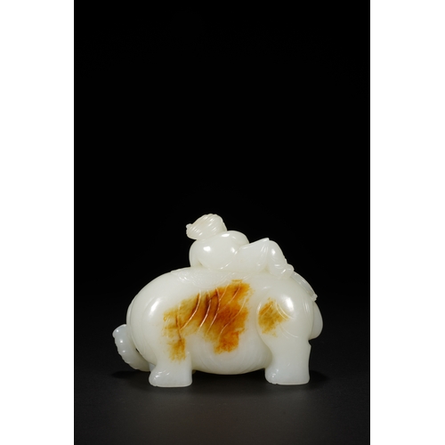 26 - A white jade carving 'boy and elephant' group, Qing Dynasty 11.5cm long, 9cm high