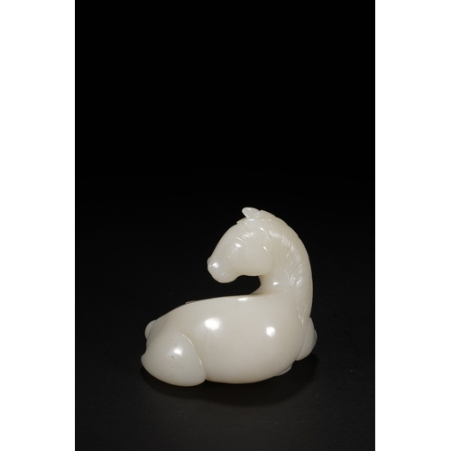 27 - A white jade carving 'horse', Qing Dynasty 8.5cm long, 7.7cm high