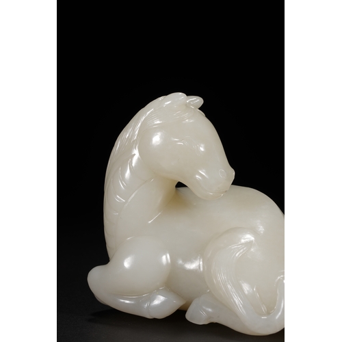 27 - A white jade carving 'horse', Qing Dynasty 8.5cm long, 7.7cm high