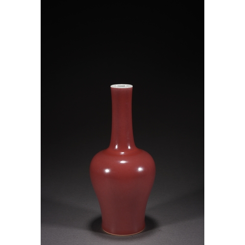 31 - A copper-red glazed vase with woodstand 23cm high, 10cm wide