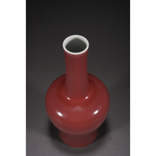 31 - A copper-red glazed vase with woodstand 23cm high, 10cm wide