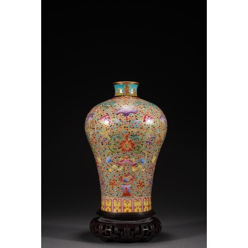 32 - A famille-rose 'eight treasures' meiping vase 21cm high, 13cm wide