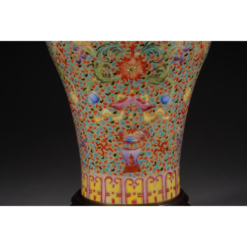 32 - A famille-rose 'eight treasures' meiping vase 21cm high, 13cm wide