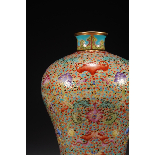 32 - A famille-rose 'eight treasures' meiping vase 21cm high, 13cm wide