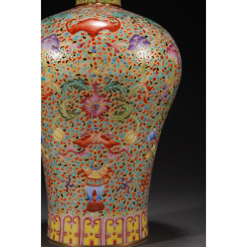 32 - A famille-rose 'eight treasures' meiping vase 21cm high, 13cm wide