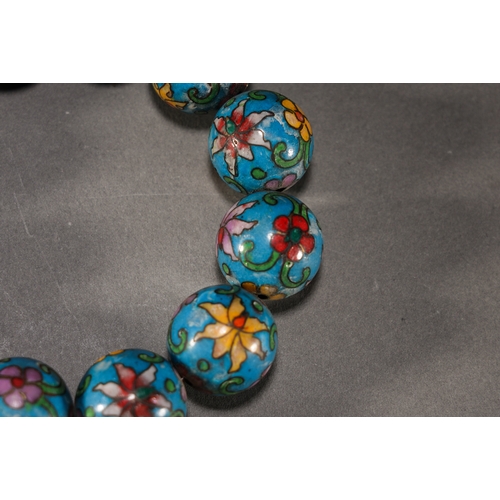 34 - A cloisonné floral bracelet, Qing Dynasty each bead approx. 2cm diameter