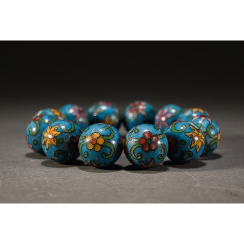 34 - A cloisonné floral bracelet, Qing Dynasty each bead approx. 2cm diameter