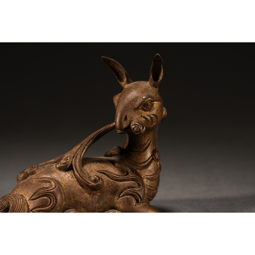 4 - A copper gilt 'mythical beast' paperweight8cm long