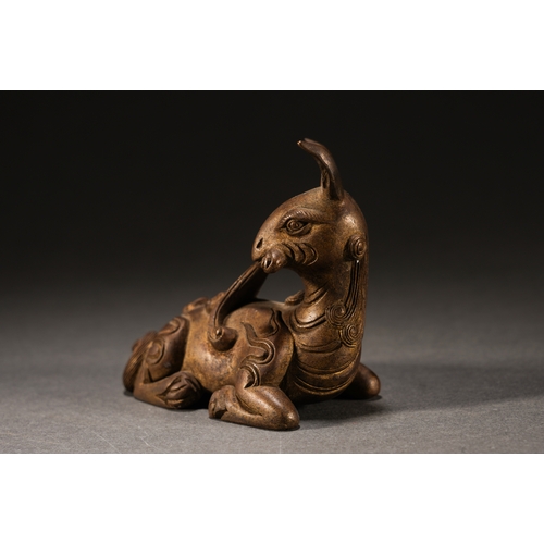 4 - A copper gilt 'mythical beast' paperweight8cm long