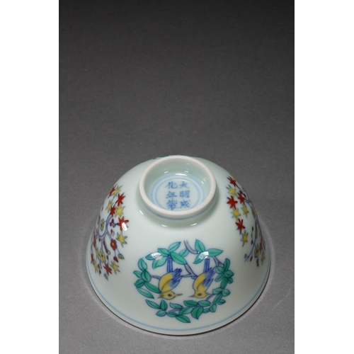 46 - A wucai 'birds and floral' cup with chenghua six-character mark8.3cm diameter, 5.5cm high