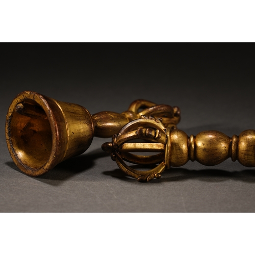 5 - A set of bronze gilt ritual implementsthe larger one 11.5cm long